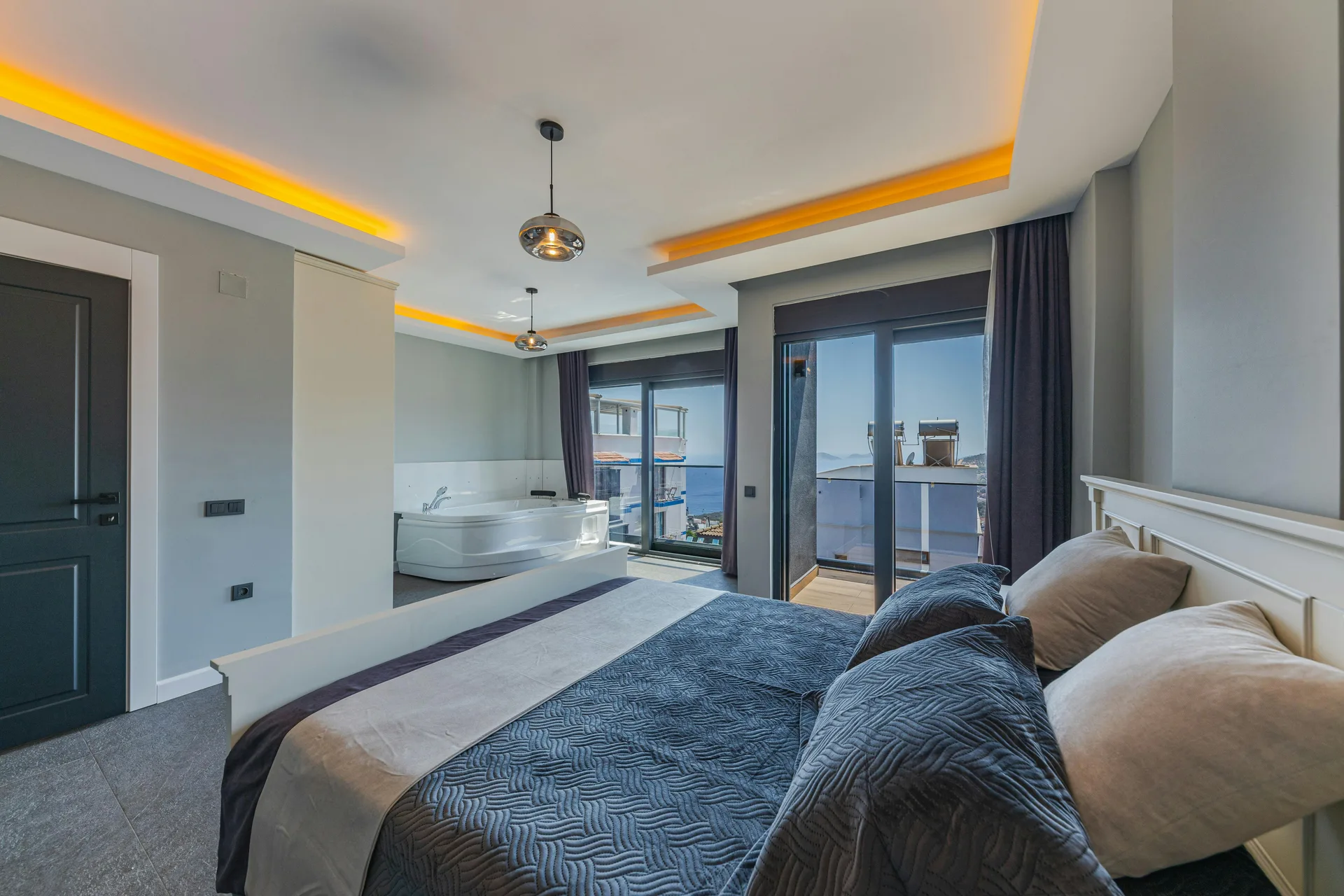 Master bedroom with jacuzzi and balcony